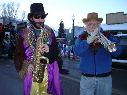 Sax and trumpet players keep the groove.